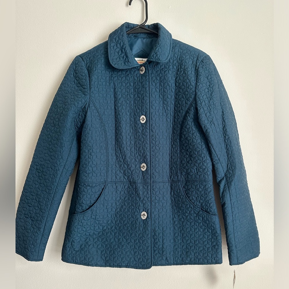 Blue quilted jacket with button front and pockets